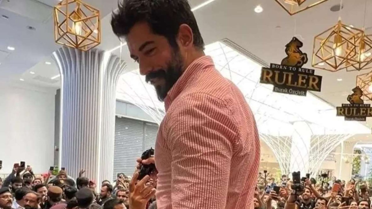 burak Özçivit parfüm lansmanında erkek hayranlarının akınına uğradı
